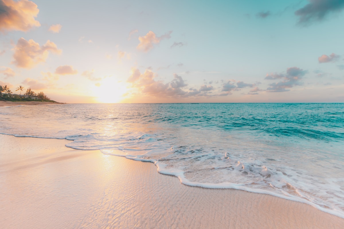 Beautiful sunset over a white sand Florida beach with turquoise water